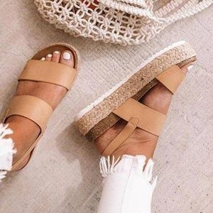 Platform sandals. Never worn.